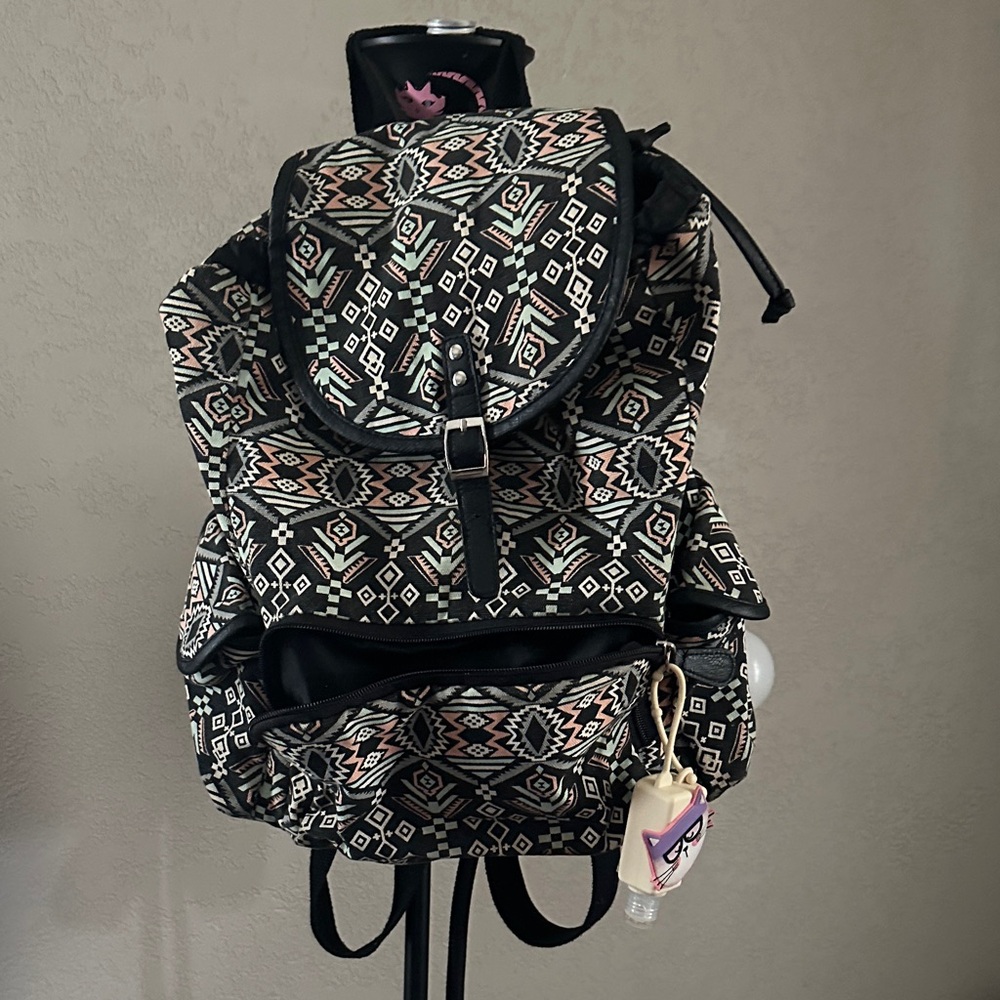 Patterned Backpack With Black And White Accents - image 1